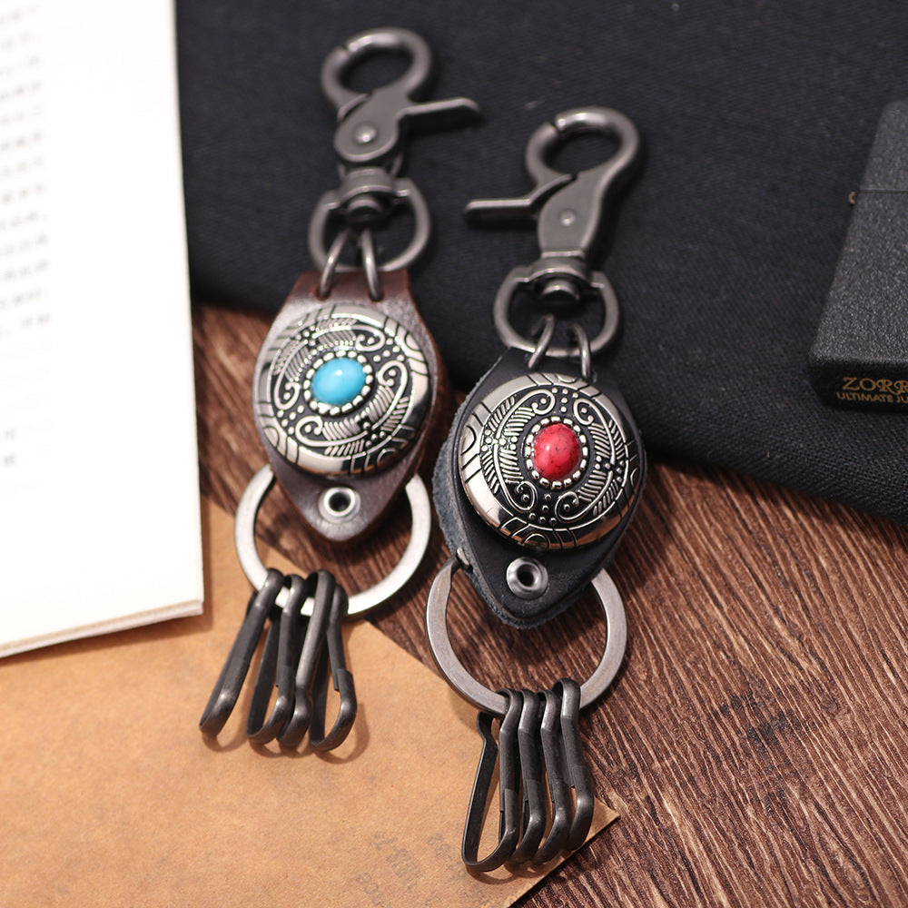 Spiritual Guardian · Turquoise Inlaid Alloy and Cowhide Feather Keychain Pendant