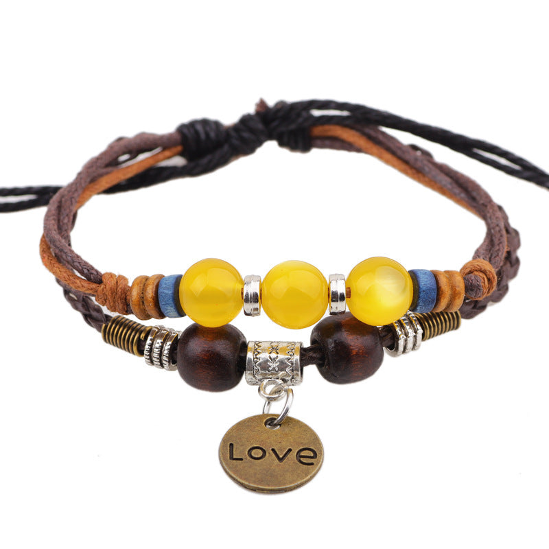 Handgewebtes Damenarmband aus Wachsseil mit Kristallperlen.