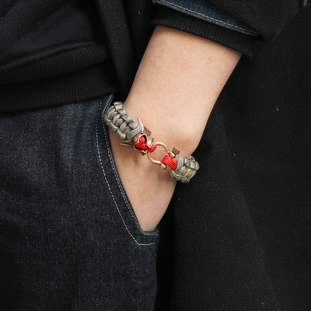 Pulsera de paracord para hombre con protección energética de cobre con bendición de guerrero nórdico.
